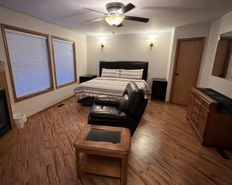 High End King Suite c/w Living room, 2 Fireplaces, 2 Smart TVs, Kitchenette. - Three Hills