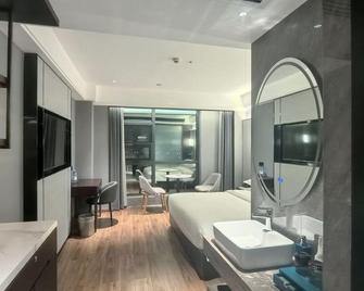 Bonny International Hotel - Shaoyang - Bedroom