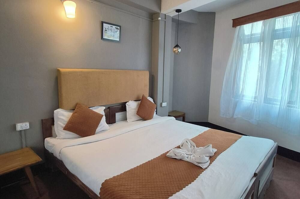 Hotel Sakura Darjeeling - דאריילינג - חדר שינה