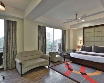Collection O 46731 The Grand Eden - Ahmedabad - Habitación