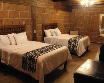 Hotel Real Nirvana - Tecozautla - Спальня