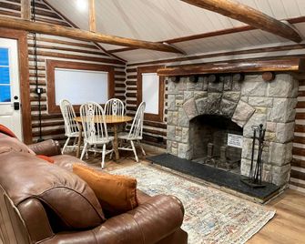 Charming Riverfront Cabin with Hot Tub and Dock Access Near Scenic Trails in Island Park, Idaho - Island Park - Living room