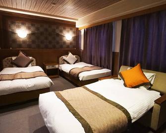 Hotel Areaone Kochi - Kochi - Phòng ngủ