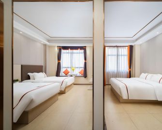 Jia Hua Boutique Hotel (Wanda Plaza Branch) - Dongfang - Bedroom