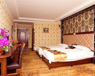 Labusi Hotel - Yushu - Camera da letto