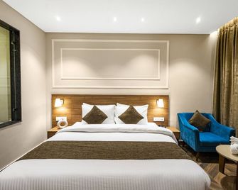 Pride Hotel And Resort Rishikesh - Rishikesh - Bedroom