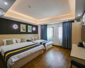 Haikou Xiehou Boutique Homestay (Bell Tower Qilou Old Street Branch) - Haikou - Bedroom