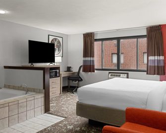 Ramada by Wyndham Cedar Rapids South - סידר ראפידס - חדר שינה