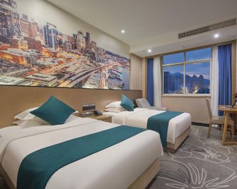 Ouyin Conference HotelTaizhou International Convention and Exhibition Center Branch) - Taizhou - Slaapkamer