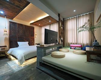 China Old Story Inn Lijiang Elite Garden - ליז'יאנג - חדר שינה