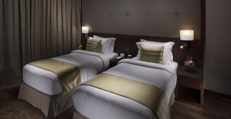 Ramee Rose Hotel - Manamah - Slaapkamer