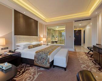 Oriental International Hotel - Yichang - Schlafzimmer