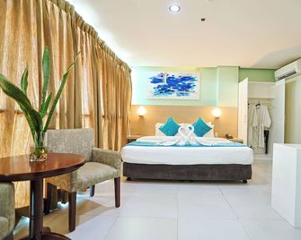 Empire Suites Hotel - Puerto Princesa City - Slaapkamer