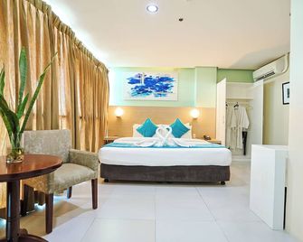 Empire Suites Hotel - פוארטו פרינססה סיטי - חדר שינה