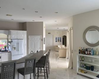 Amazing villa with view and direct access to the water.\nHeated pool and jacuzzi. - North River Shores - Dining room
