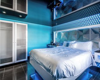 أولكس هوتل موتل آند سويتس - لافال - غرفة نوم