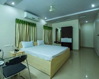 Hotel Jagadeeswari - Rājahmundry - Спальня