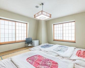 Business Hotel Azalea Gunma Kusatsu - Kusatsu - Schlafzimmer