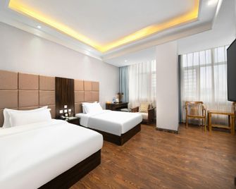 Harbin Blue Feather Hotel - Charbin - Ložnice