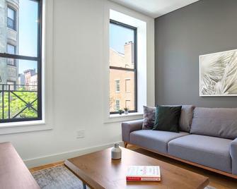 Dreamy Nolita 1BR w/ W/D, Heated Bathroom, above SoHo cafe, by Blueground - New York - Living room