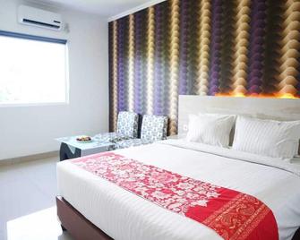 Mel's Inn Manado - Manado - Habitación