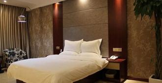 Greentree Inn Nantong Tongzhou Shiji Avenue Jianghaihuangdu Express Hotel - Nantong - Bedroom