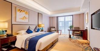 Ordos Taihua Langjing Hotel - Ordos City - Bedroom