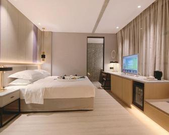 Puhe Hotel - Bozhou - Schlafzimmer