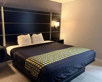 Coratel Inn & Suites by Jasper Hastings - Hastings - Schlafzimmer