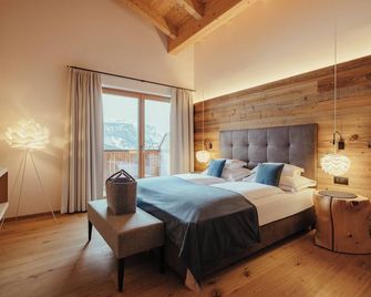 Villa Flora Mountain Lodges - St. Kassian - Schlafzimmer