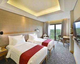 Famvida Hotel Lubuklinggau - Lubuklinggau - Bedroom