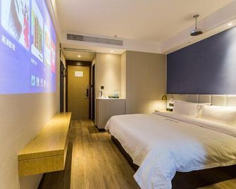 Wenrun Zhixing Holiday Hotel Nanjing Aoti Jiangdong Middle Road - Nankín - Habitación