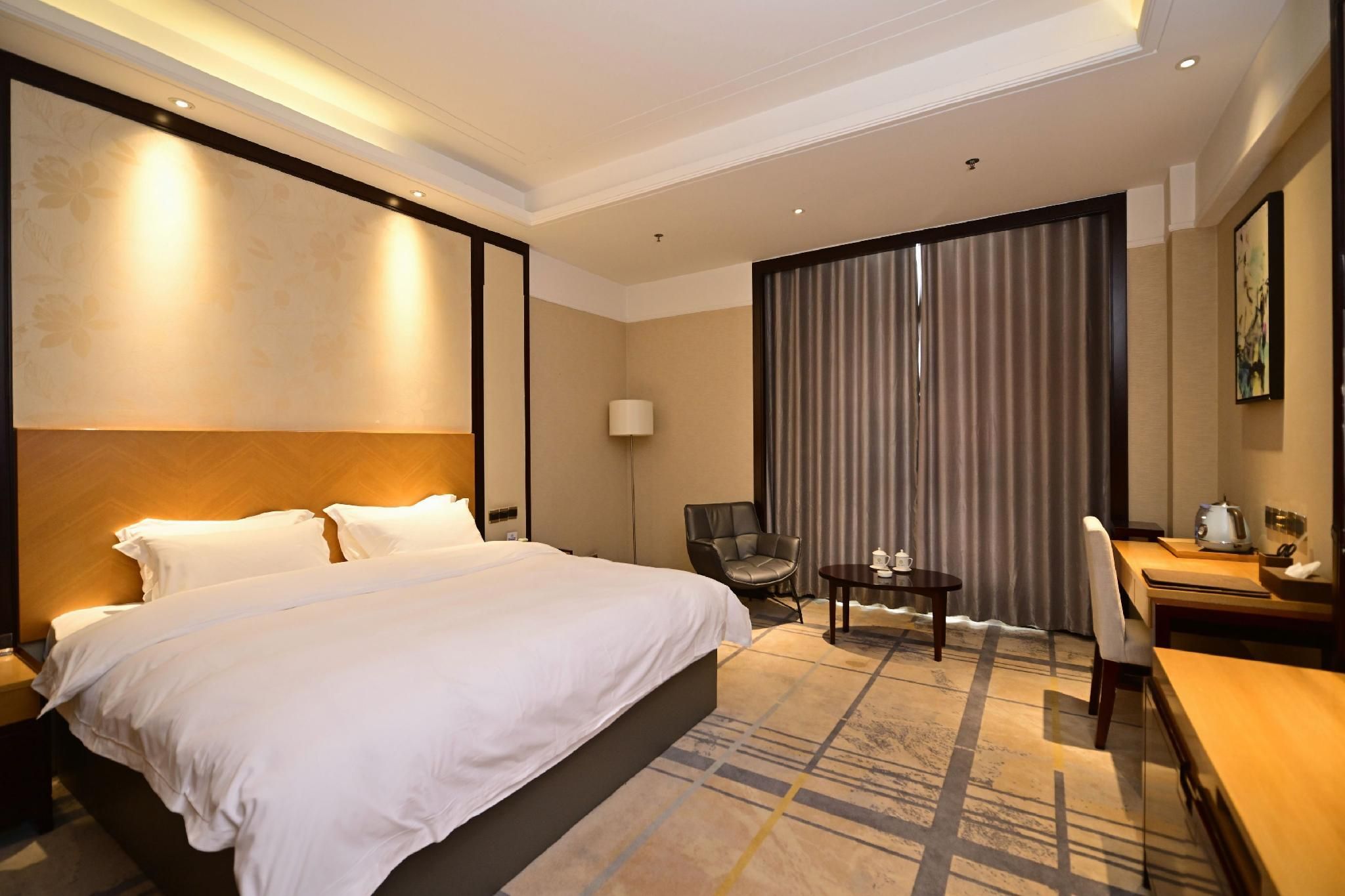 Shuiyi Jianianhua Hotel - Heze - Спальня