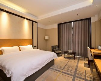 Shuiyi Jianianhua Hotel - Heze - Slaapkamer
