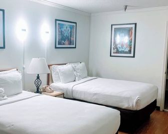 Contempra Inn - Kenner - Schlafzimmer