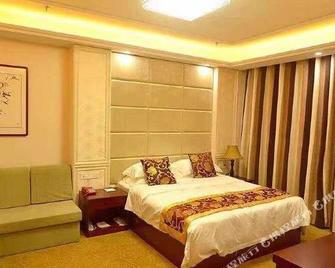 Asia Hotel - Zibo - Schlafzimmer