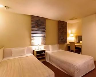 Leo Plaza Hotel - Сасебо - Спальня