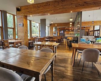 Pioneros Suites by Grupo Tierra Gaucha - San Carlos de Bariloche - Restaurant