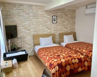 Kyoto Uraraka Guest House - Kyōto - Schlafzimmer