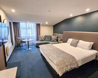 Distinction Luxmore Hotel - טה אנאו - חדר שינה