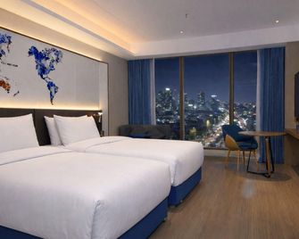 Xinmanlou Huiyuan International Hotel - Suzhou - Спальня
