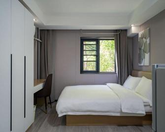 Green Tree Inn Shanghai Baoshan District Gucun Park - شنغهاي - غرفة نوم