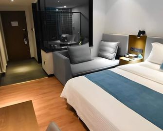 Greentree Rizhao Lanshan Coach Station Hotel - Rizhao - Schlafzimmer