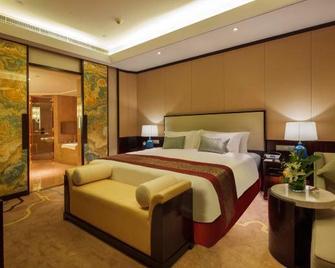 Howard Johnson Jinyi Hotel Chongqing - Chongqing - Schlafzimmer