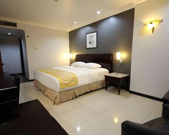 Hotel Banjarmasin International - Banjarmasin - Slaapkamer