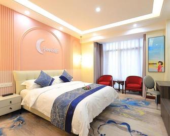 Hanjue Hotel - Ciuciang - Yatak Odası