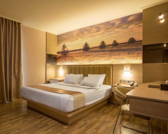 Star Hotel - Pontianak - Slaapkamer
