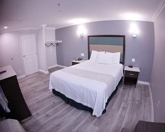 Travelodge Inn & Suites by Wyndham West Covina - West Covina - Schlafzimmer