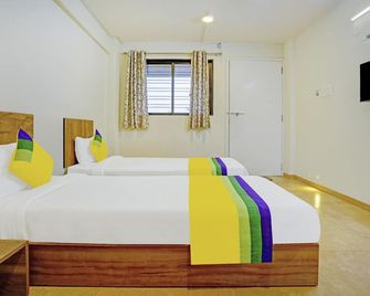 Itsy Hotels Oasis Pride - Nashik - Slaapkamer