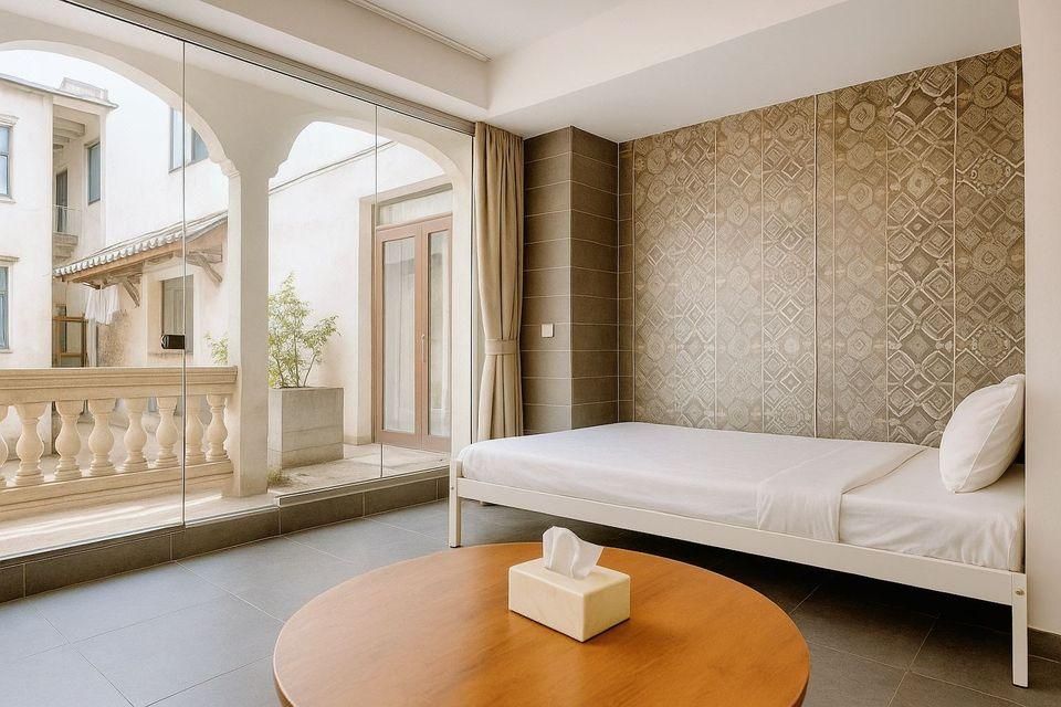 Haikou Old Arcade Street Serenity Guesthouse - האיקואו - חדר שינה